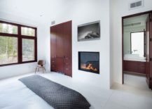 Fireplace-adds-warmth-and-elegance-to-the-bedroom-in-white-217x155