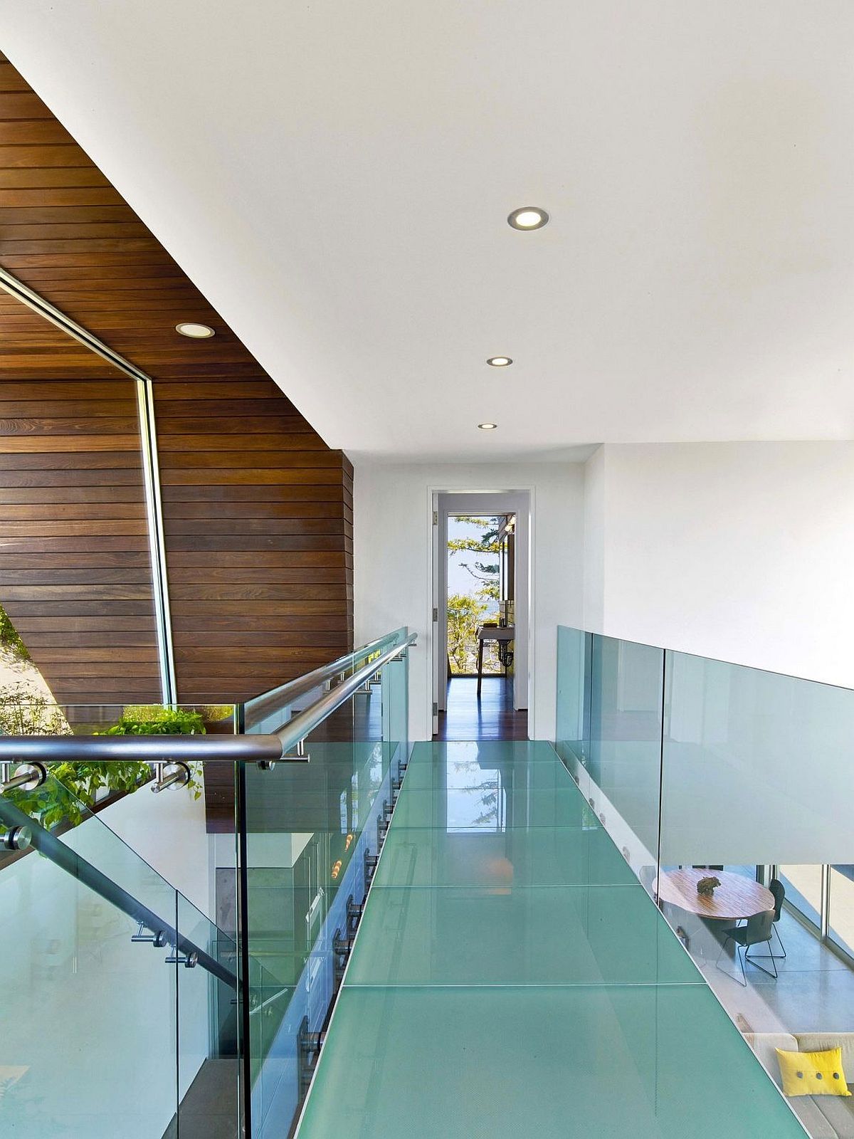 Glass walkway connecting the guest room with the master suite