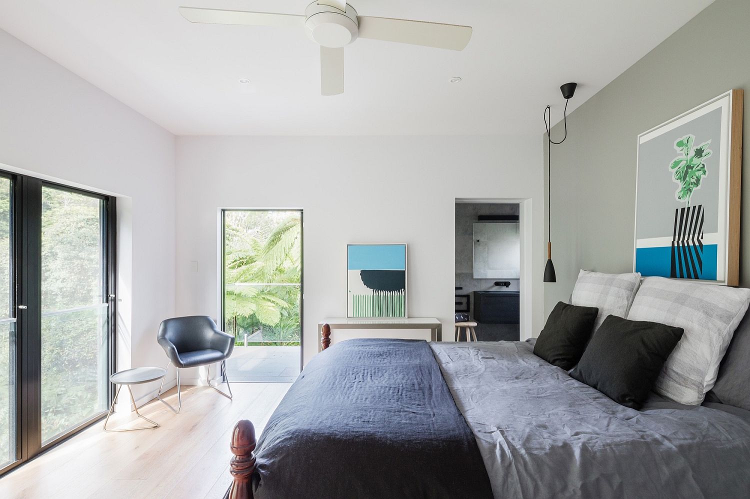 Gray and white bedroom with pops of blue