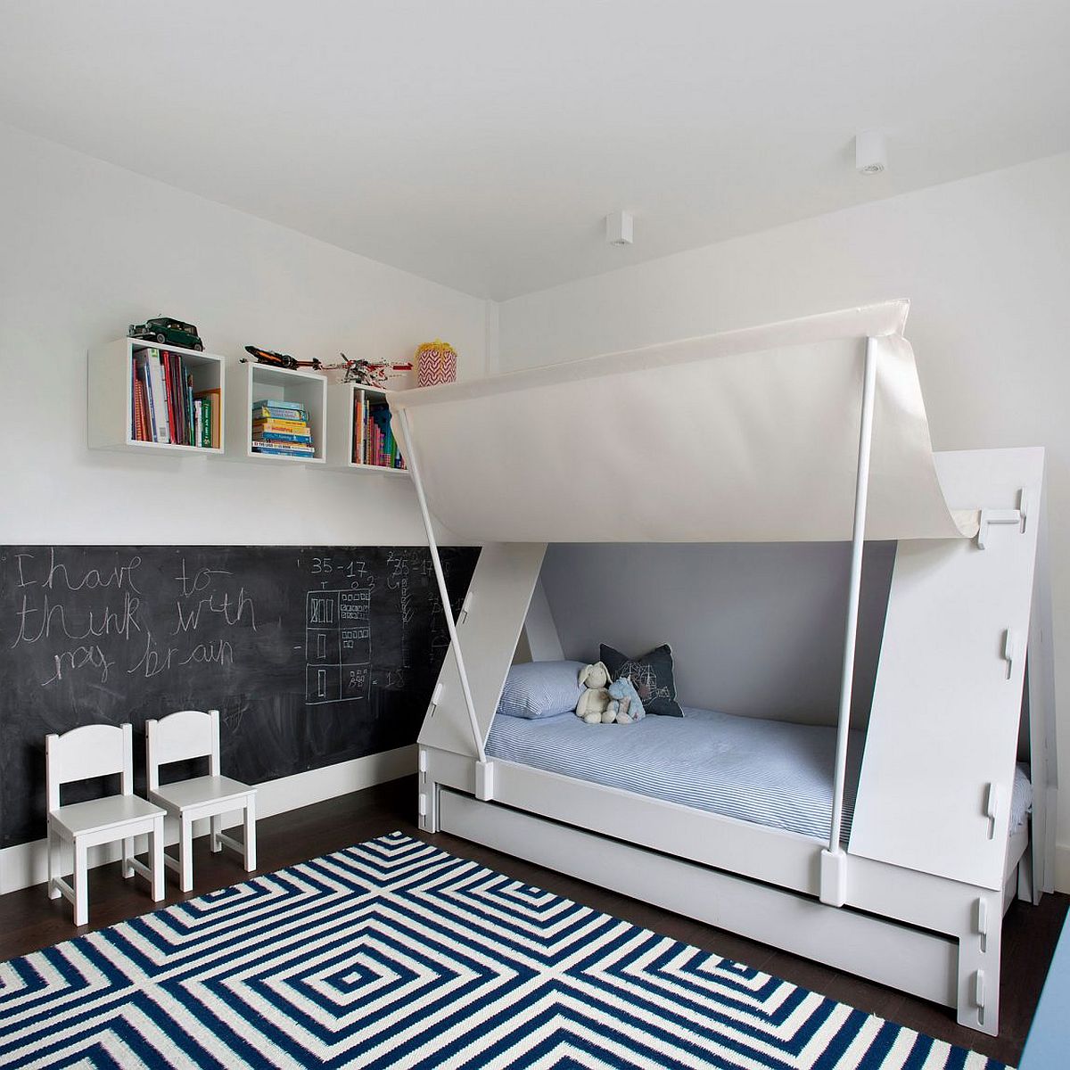 Kids' bedroom with chalkboard wall and innovative bed design