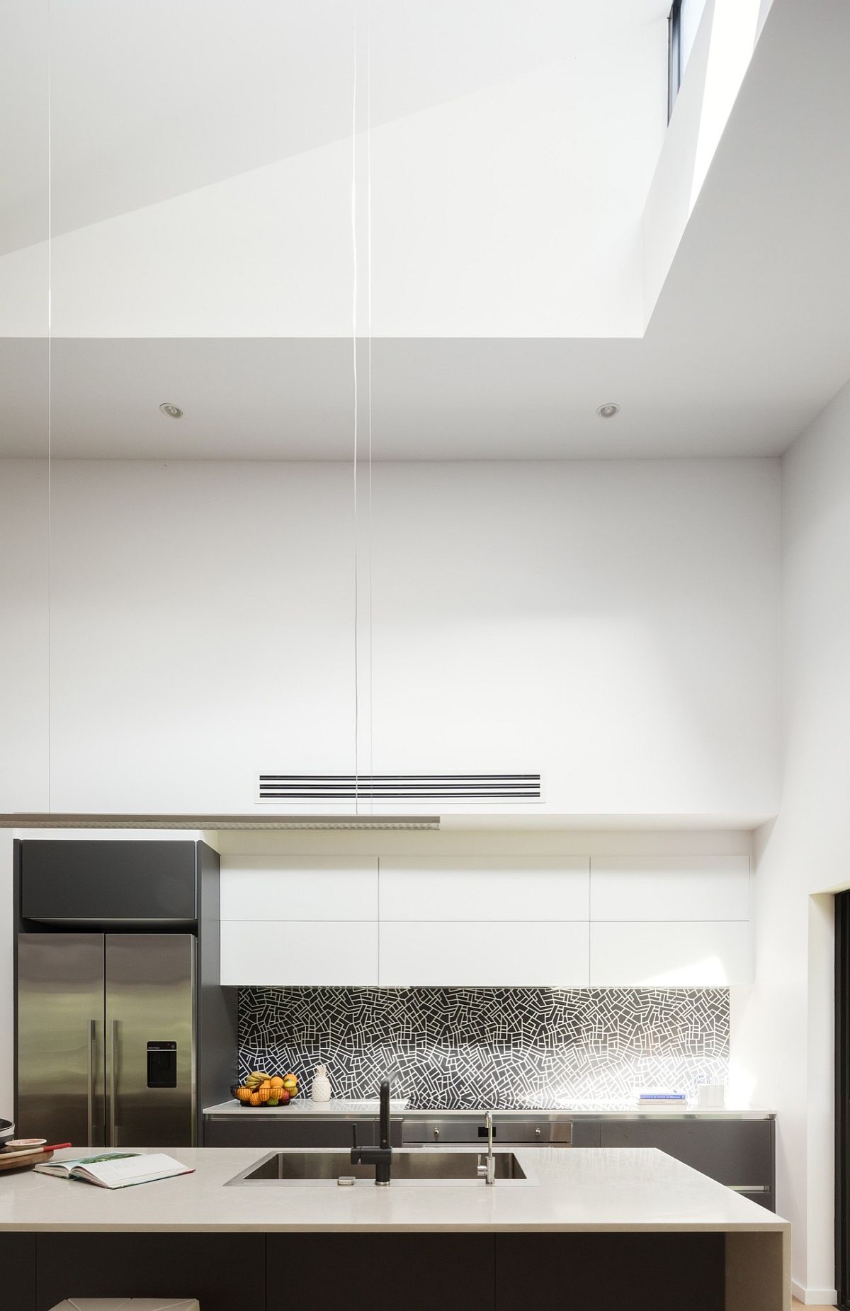 Kitchen in white with ample natural ventilation