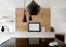 Limestone-backdrop-for-the-dining-room-in-white-with-dark-pendants-217x155