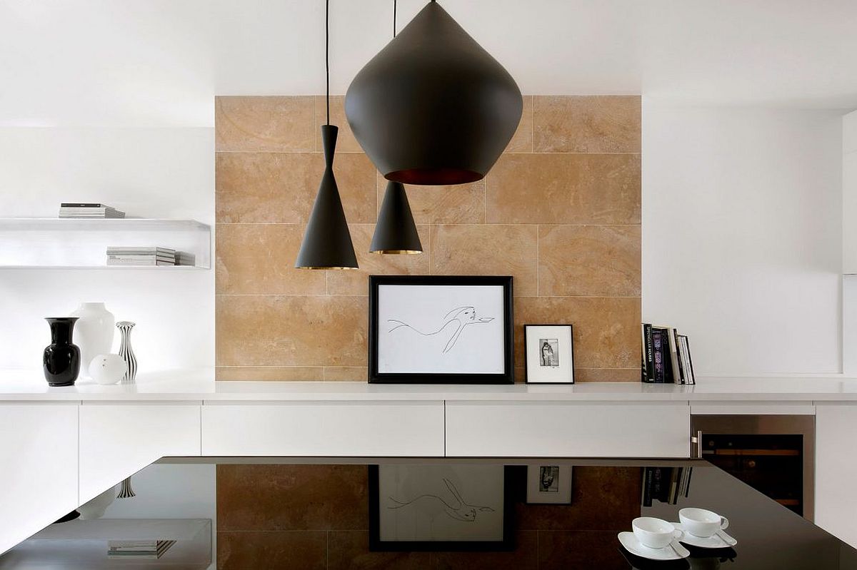 Limestone backdrop for the dining room in white with dark pendants