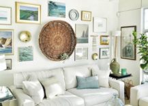 Living room gallery with a larger circular art piece and framed pictures.
