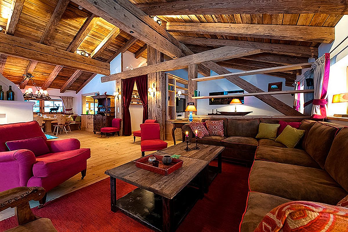 Local architecture and traditional chalet aesthetics shape the interior of Chalet Austria