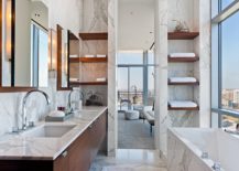Modern high-rise bathroom design with cherry floating double bathroom cabinets, marble counter tops, marble tiles floor, marble walls backsplash, polished nickel faucets and chunky floating shelves.