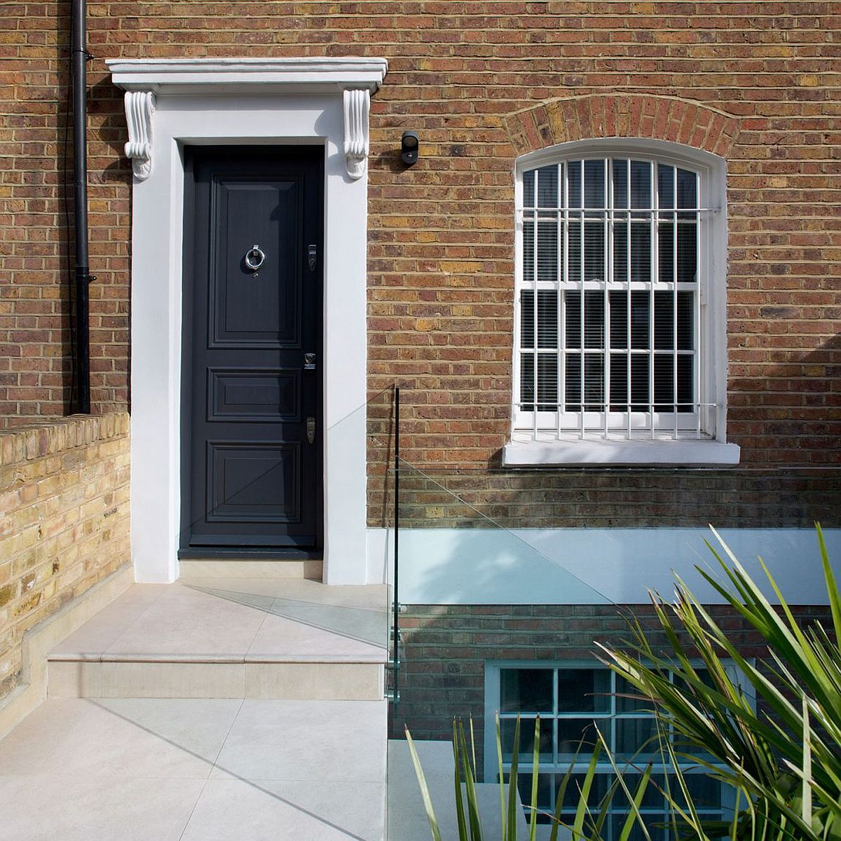 Modern makeover of classic British home on Battersea Church Road by extrArchitecture