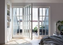 Penthouse-bedroom-in-gray-and-white-connected-with-the-small-balcony-217x155