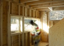 Plywood-sheathing-gives-the-interior-a-warm-cozy-interior-to-the-cabin-217x155