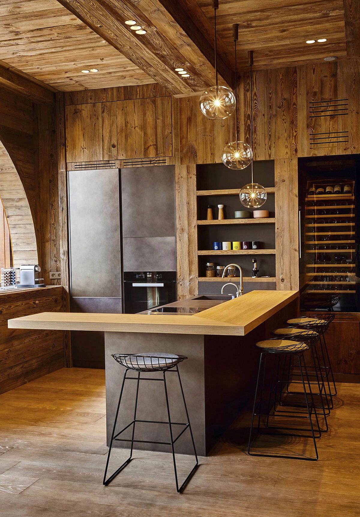 Recessed lighting coupled with sparkling pendants for the rustic modern kitchen