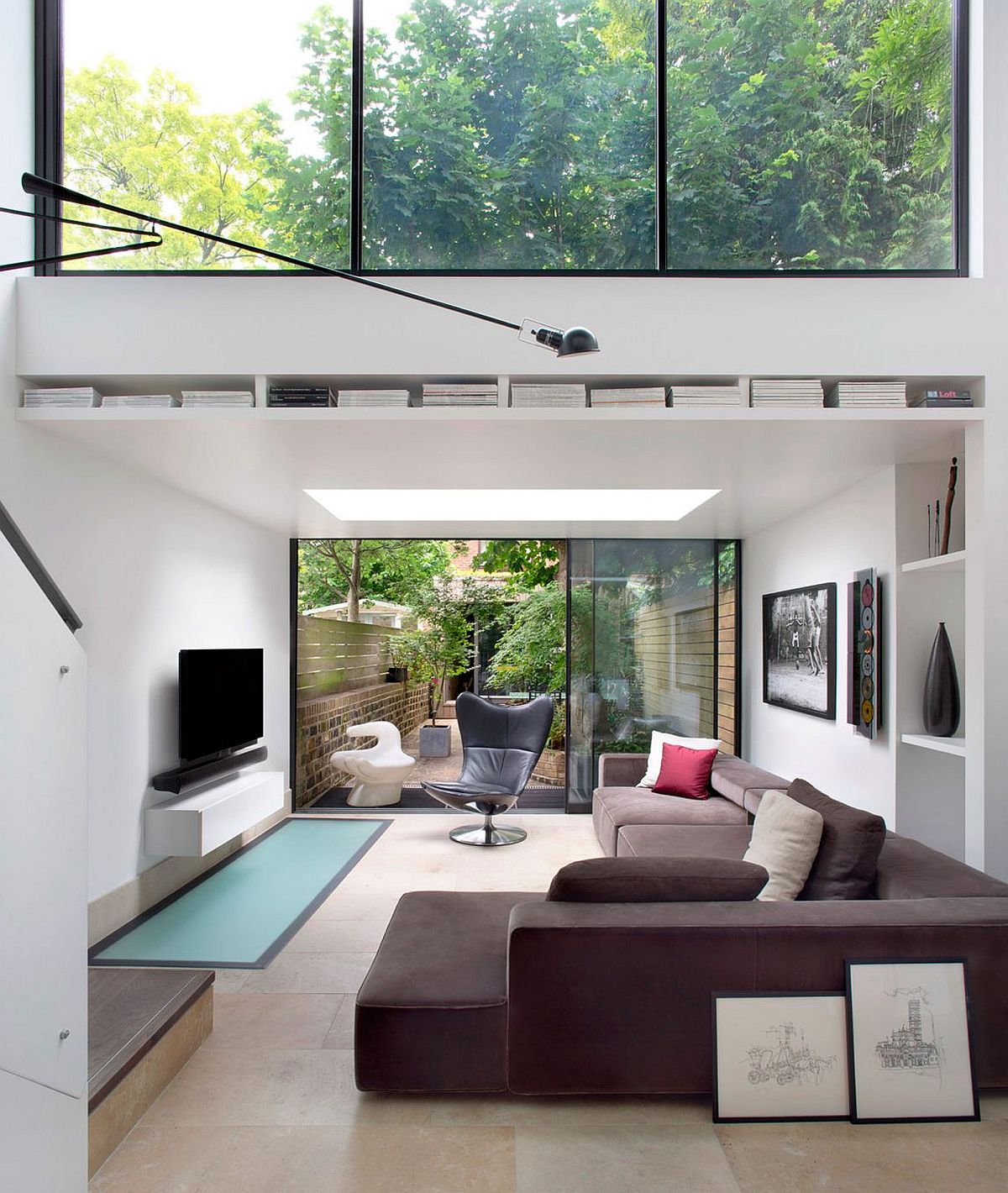 Sliding glass doors connect the living room with the rear yard