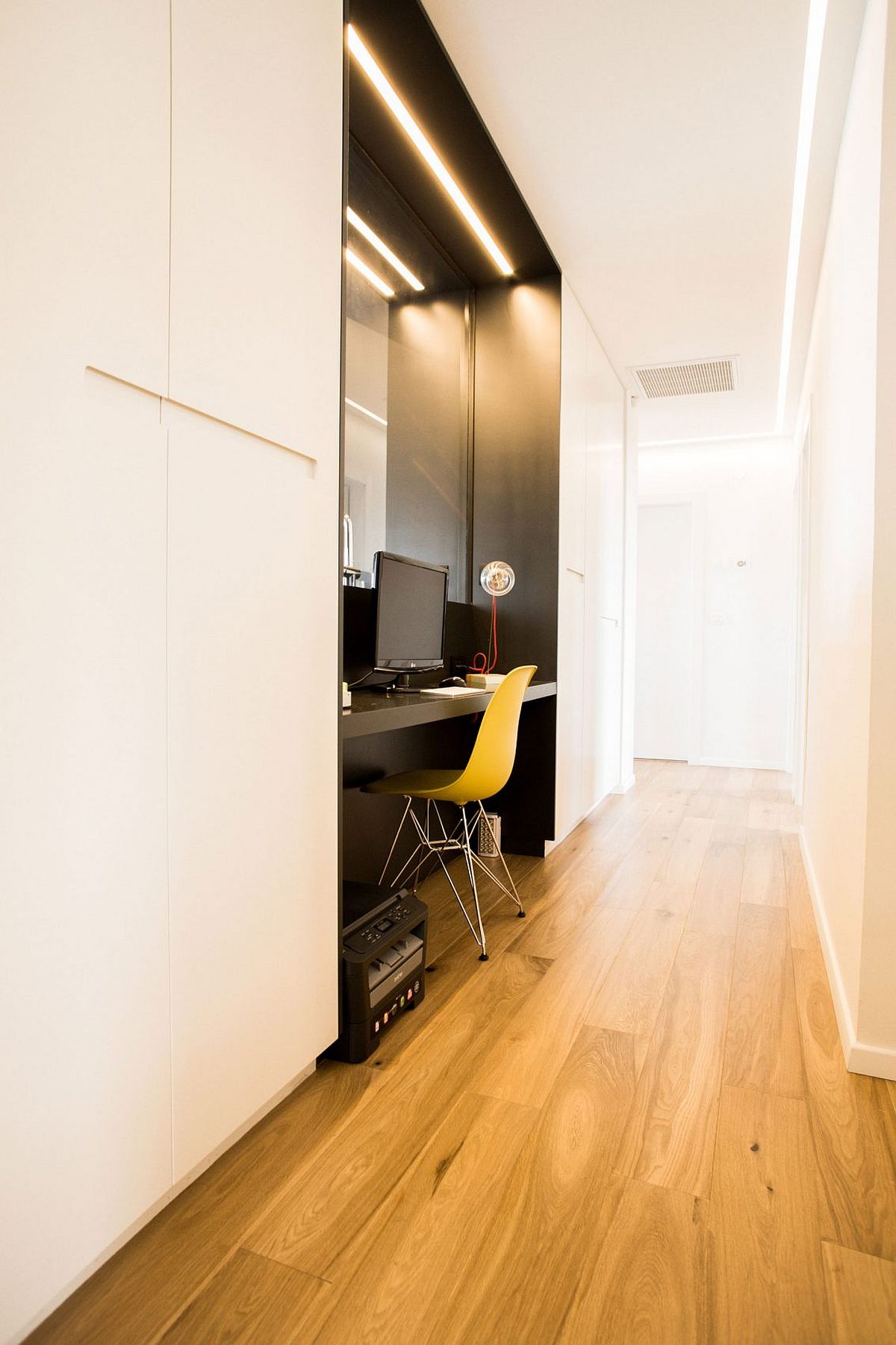 Small home office nook in the hallway is a space-saver