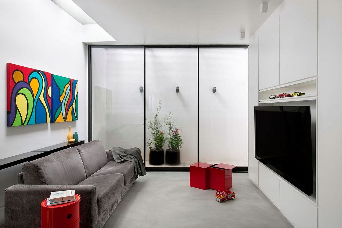 Small sitting area with a pop of color and a neutral backdrop