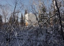 Snow-covered-forest-drapes-the-comfy-modern-cottage-217x155