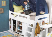 White bed with storage underneath, and a child is playing with an airplane inside a star-themed canopy.