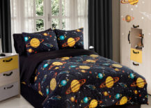 Space children's room with a space galaxy comforter.