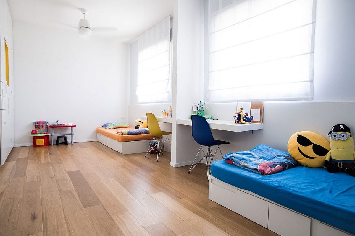 Space-savvy kids room design in white with colorful beds