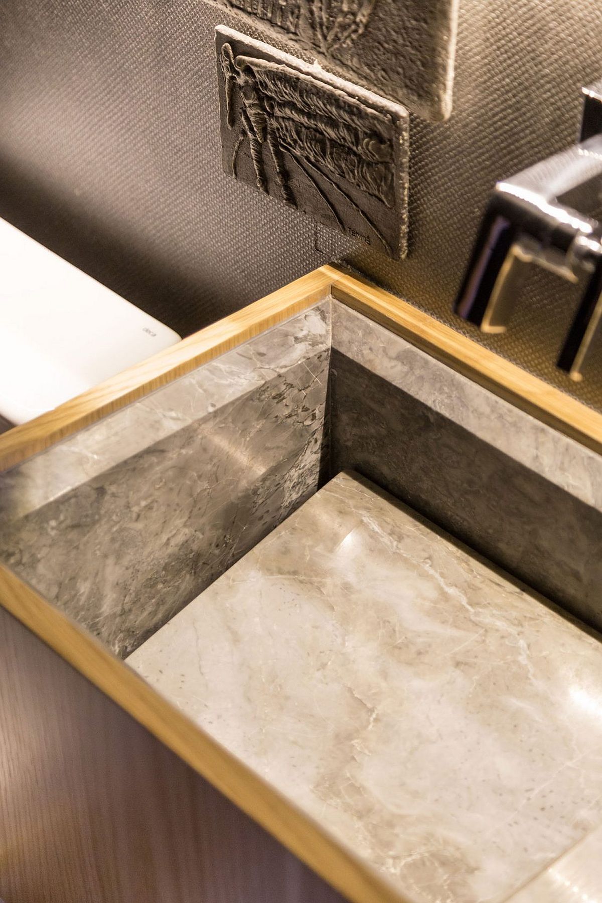 Stone-sink-for-the-bathroom-with-wooden-vanity