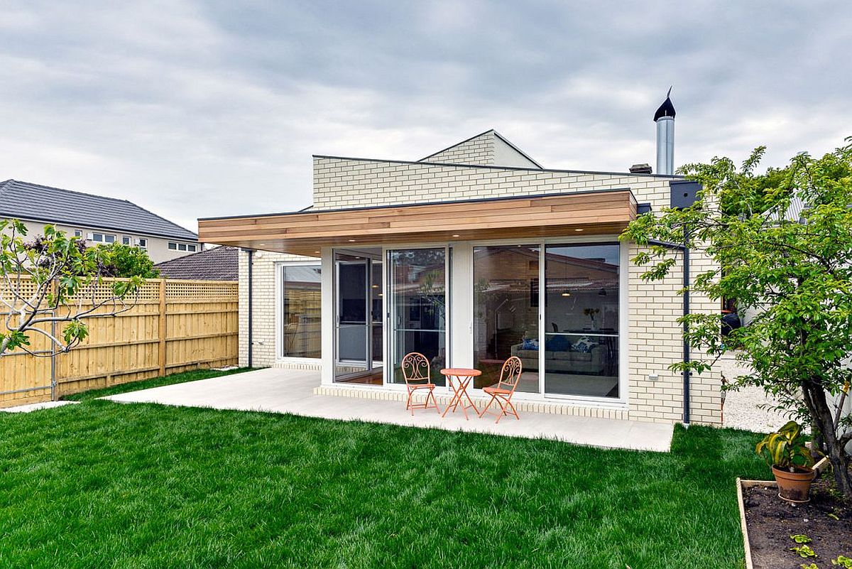 Wooden overhang gives a nice shaded patio that stretches into the garden