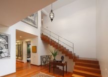 Wooden-staircase-connects-the-lower-level-with-the-top-floor-217x155