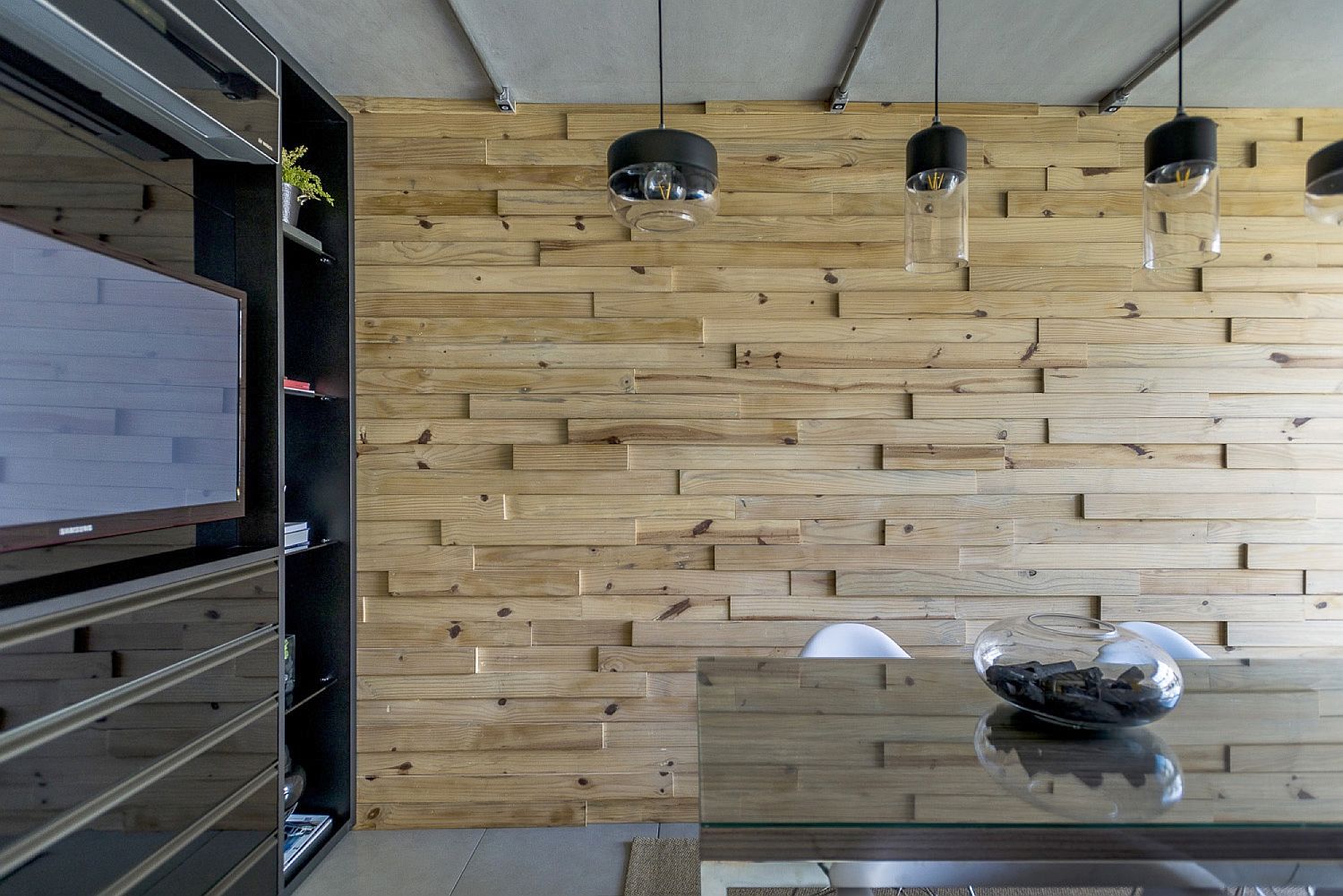 Wooden wall brings warmth to the office in steel