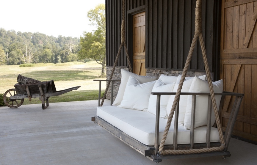 A-farmhouse-swing-will-make-your-porch-feel-cozy-