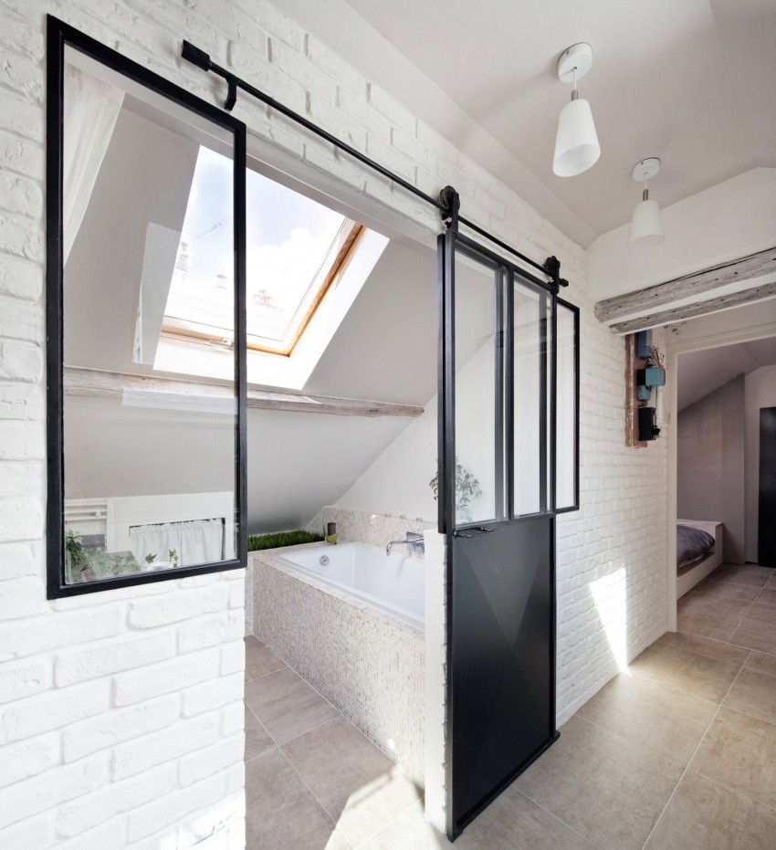 A genius attic bathroom with a slide door