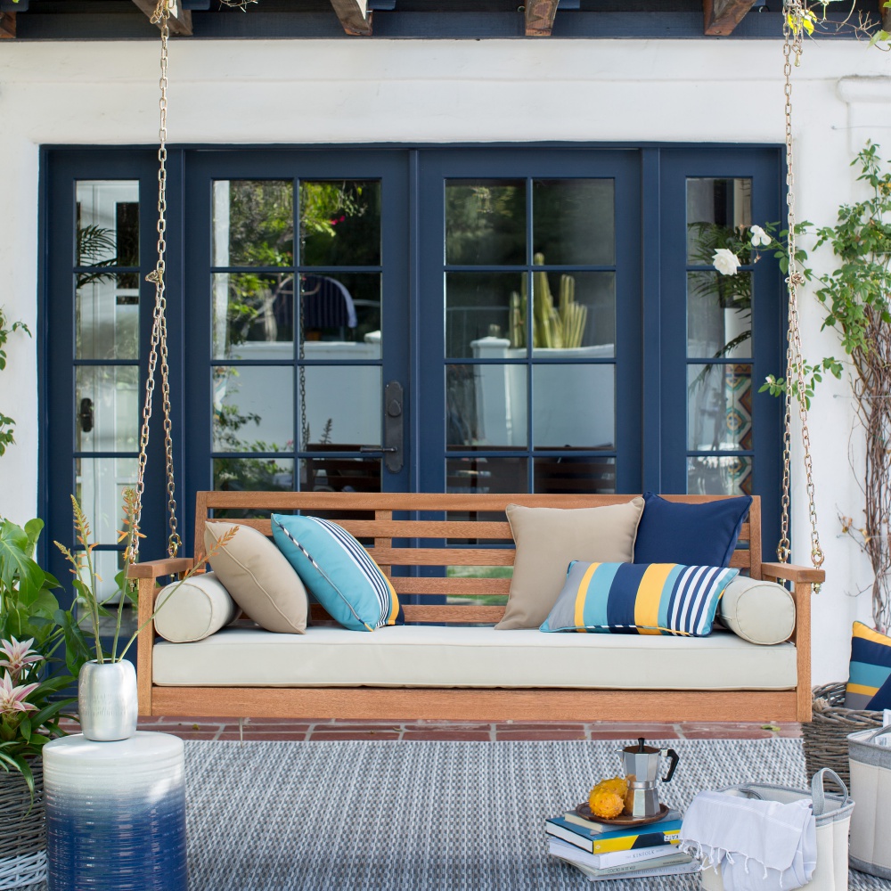 A natural porch swing that blends in with the modern decor