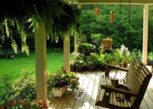 A-simple-wooden-swing-on-a-porch-surrounded-by-greenery-217x155