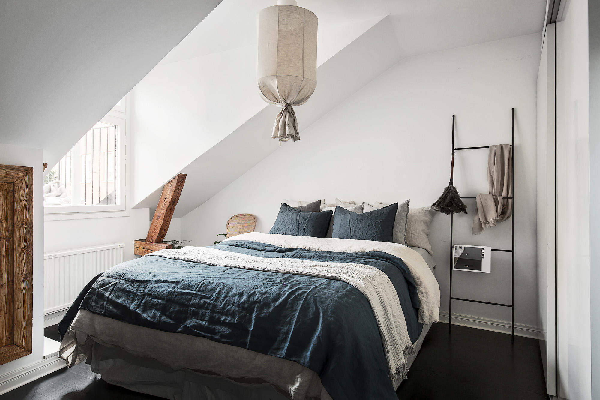 A small attic bedroom with bohemian elements