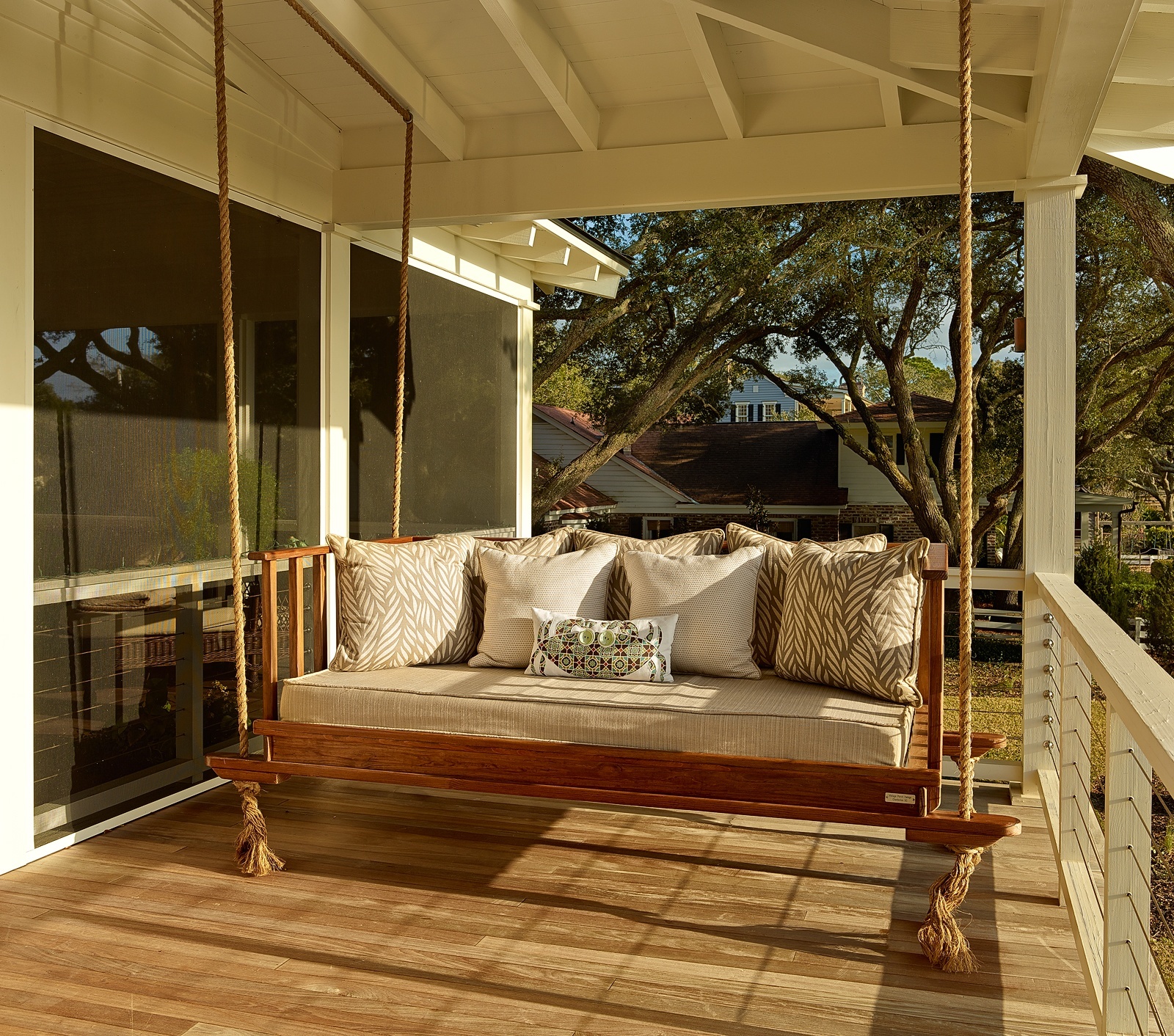 A vintage styled porch swing overlooking the countryside