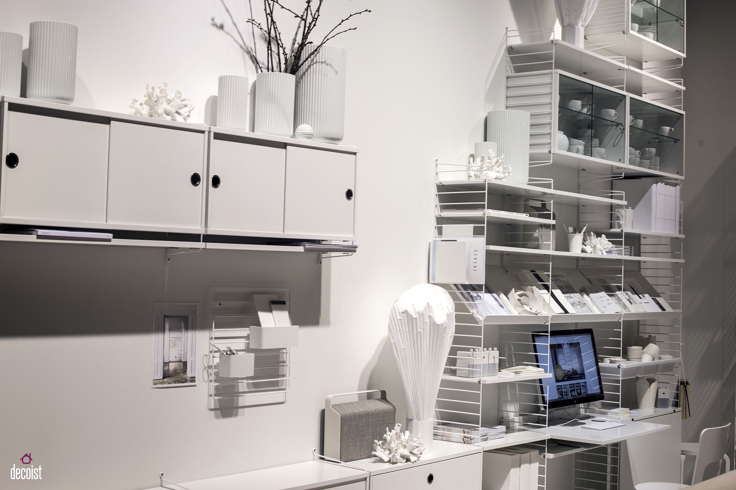 All-white home office with extensive open shelving in white from String