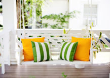 Almost-hidden-bright-white-swing-with-noticable-pillows-217x155
