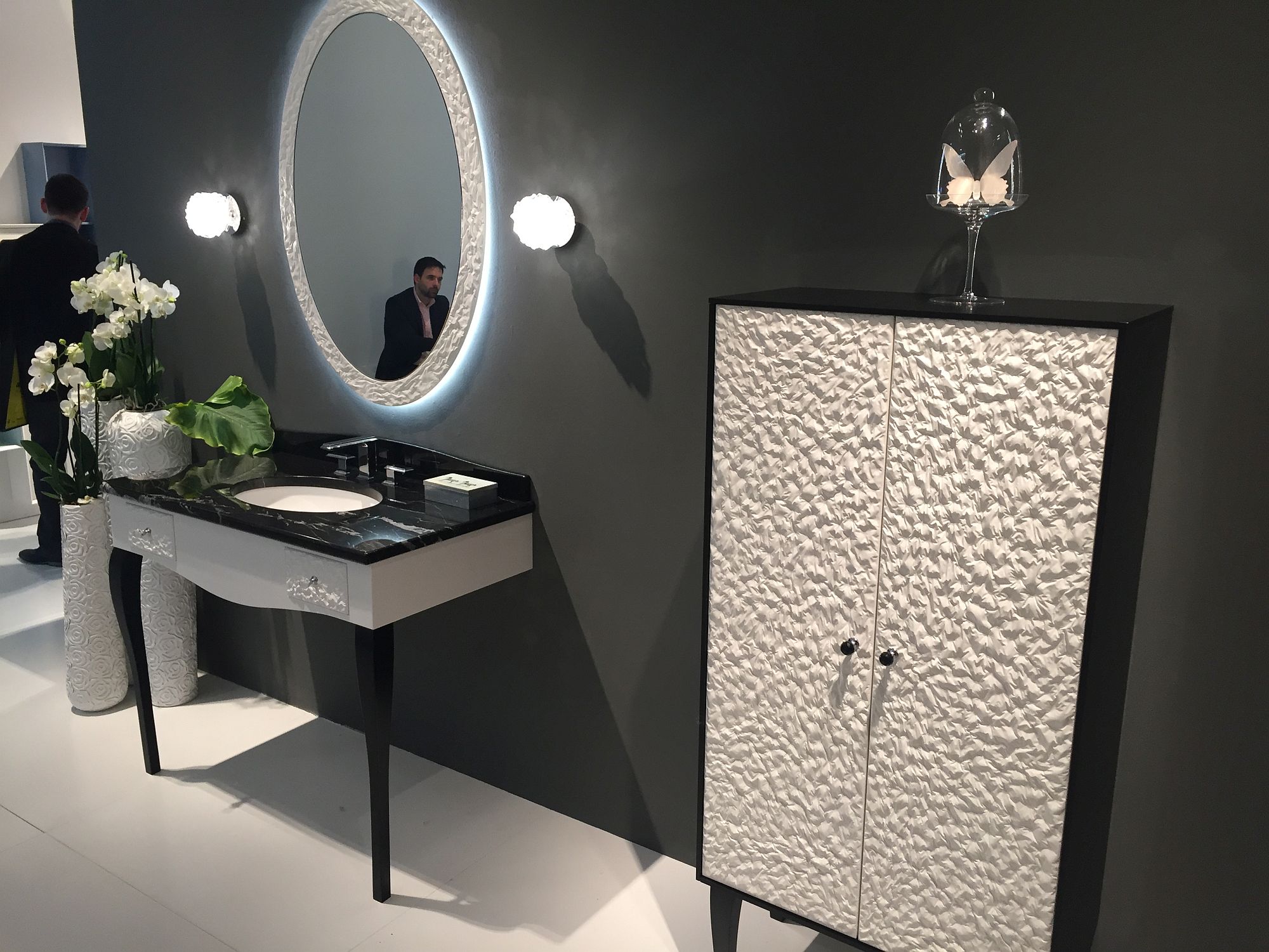 Art deco bathroom with a sink and mirror and matching vanity