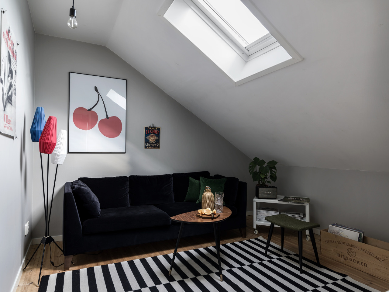 Attic living room with a small coffee table but roomy sofa