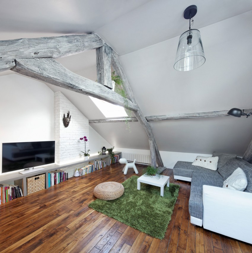 Attic living room with furniture matching the beams