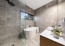 Bathtub-in-white-in-the-corner-is-a-space-saver-in-the-contemporary-bathroom-217x155