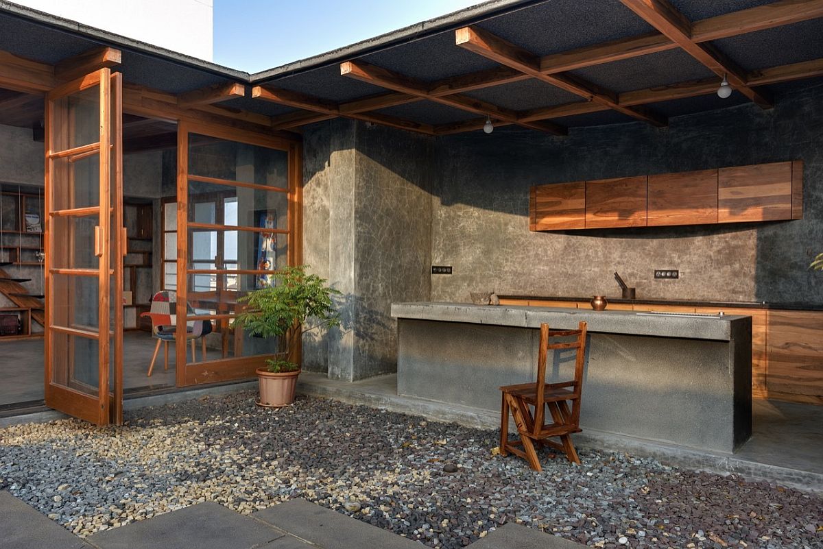 Cement wood and brass give the kitchen and pantry a unique look