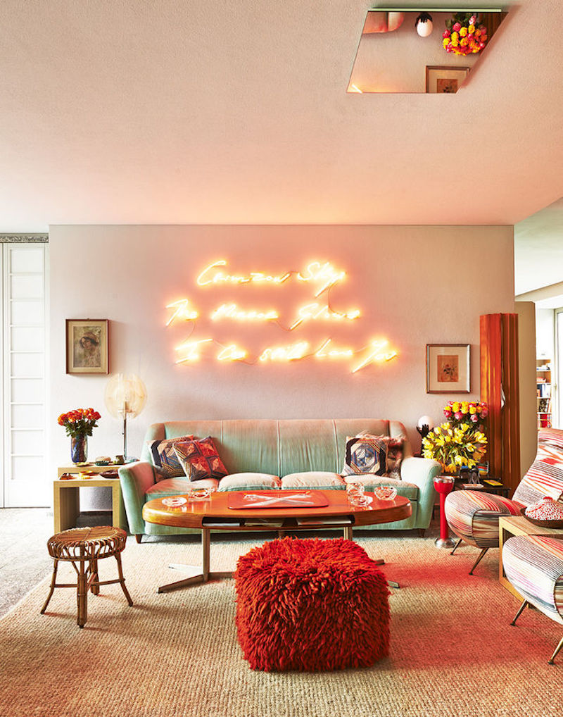 Charming living room with a blinding neon sign