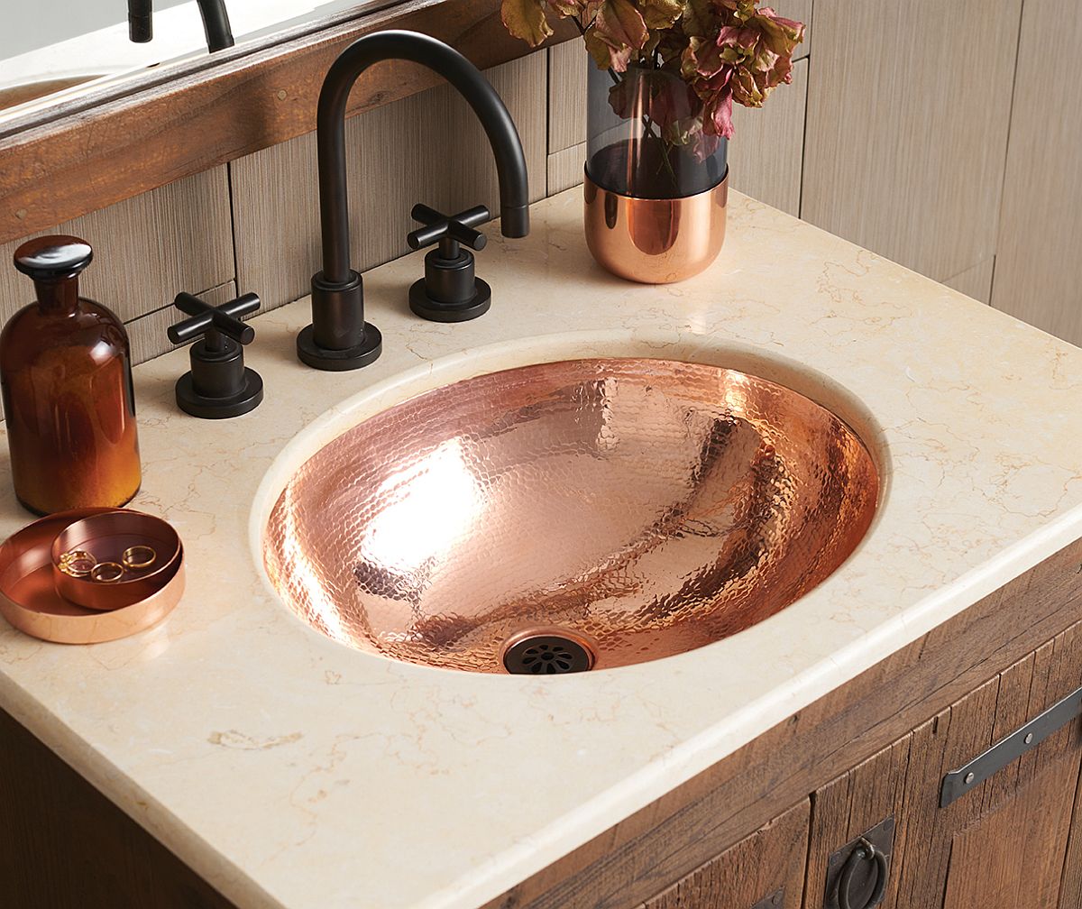 Classic-Hammered-Copper-Bathroom-sink-at-its-shiny-best