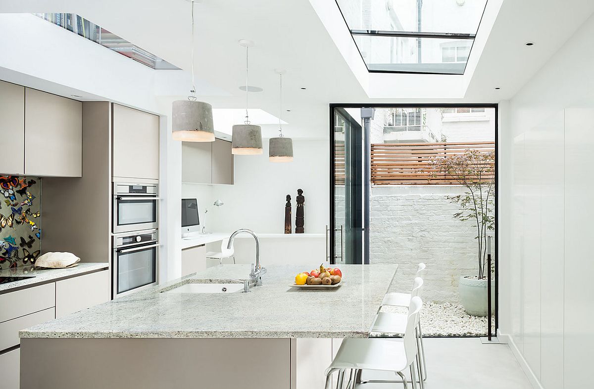 Contemporary kitchen in white of the revamped British home