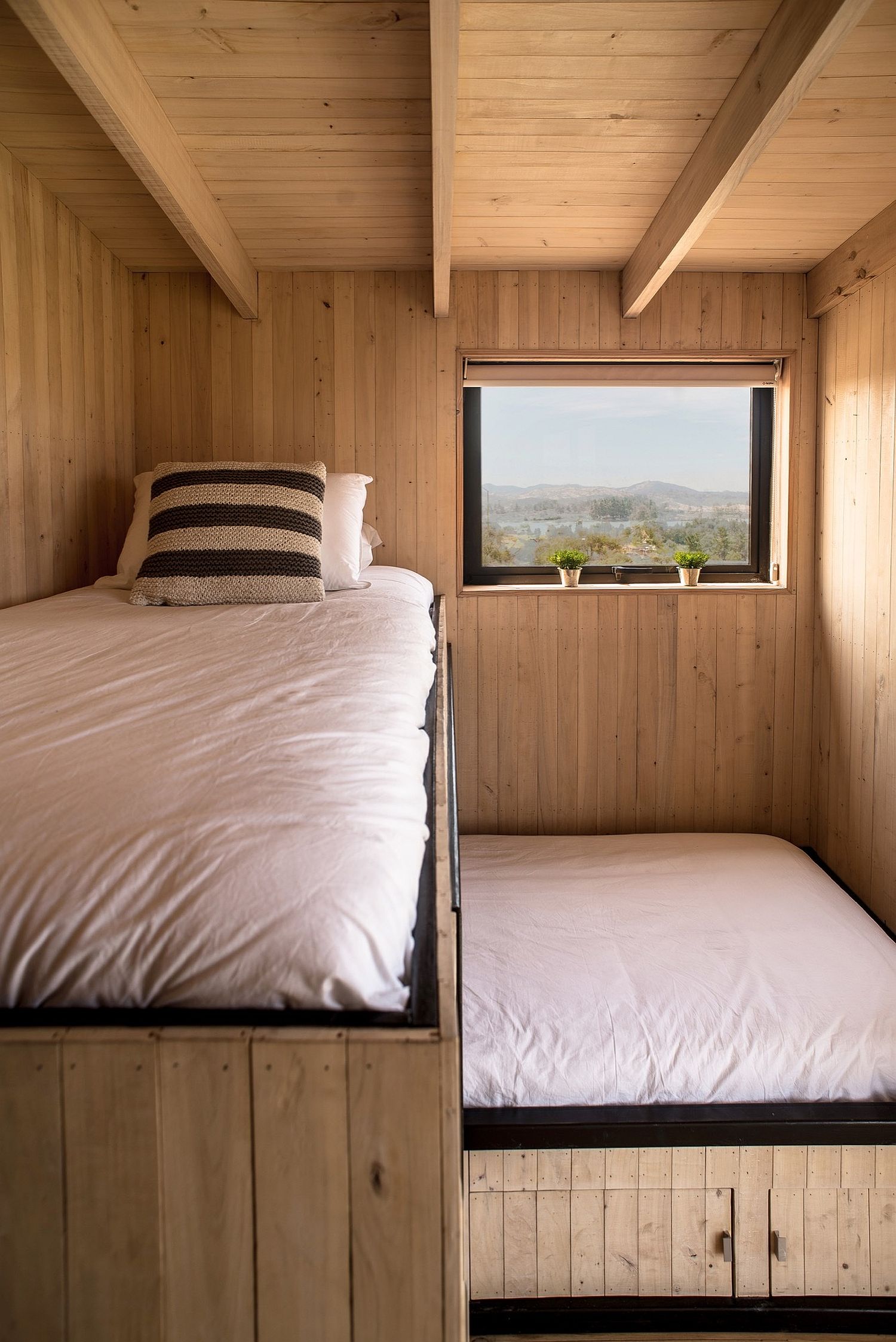 Creating space for a loft bed in the small cabin-style bedroom