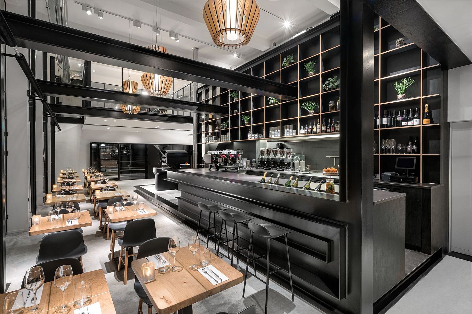 Dark metallic structure defines the new areas of the cafe