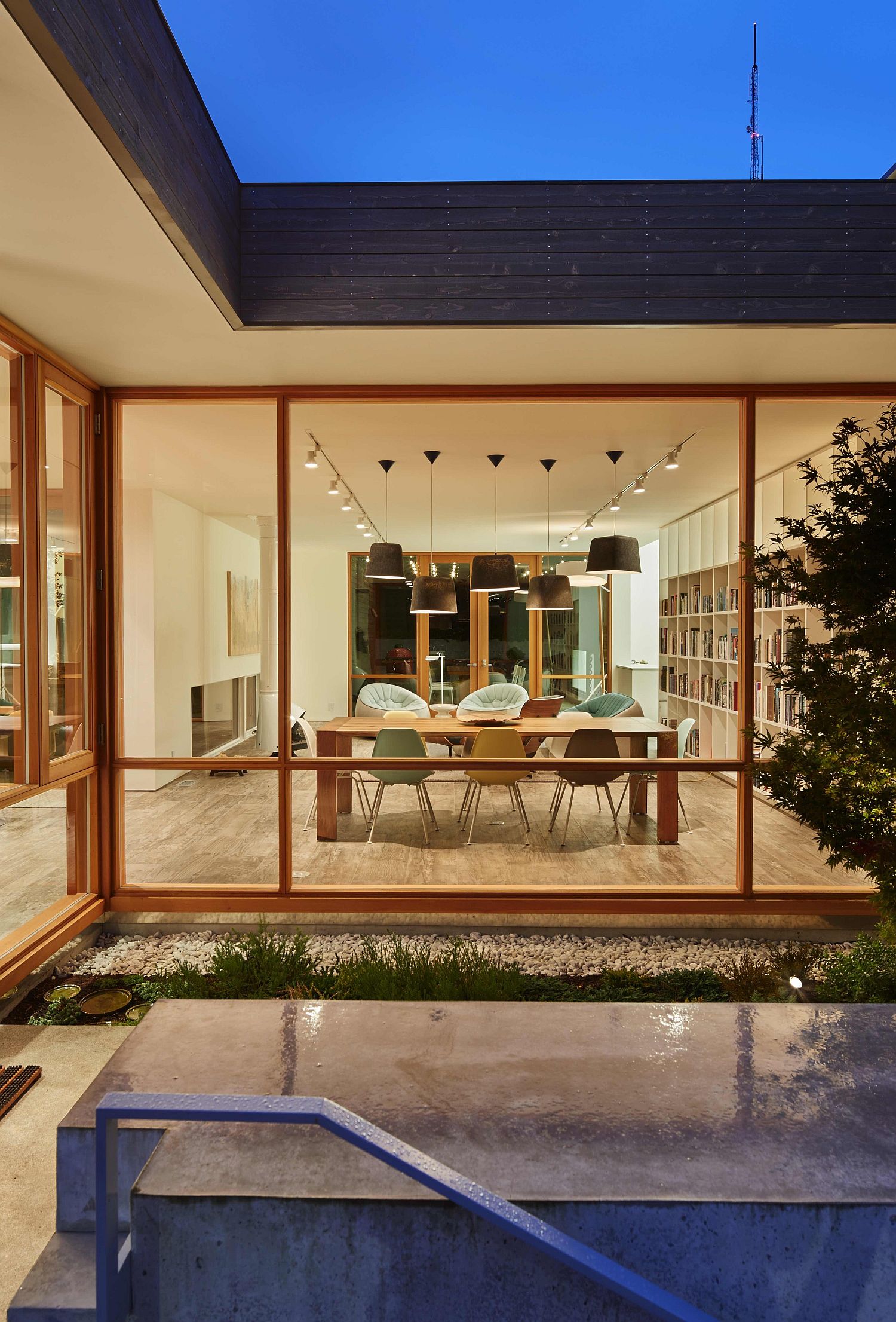 Dining space and open living space of the Artist Residence connected with the courtyard