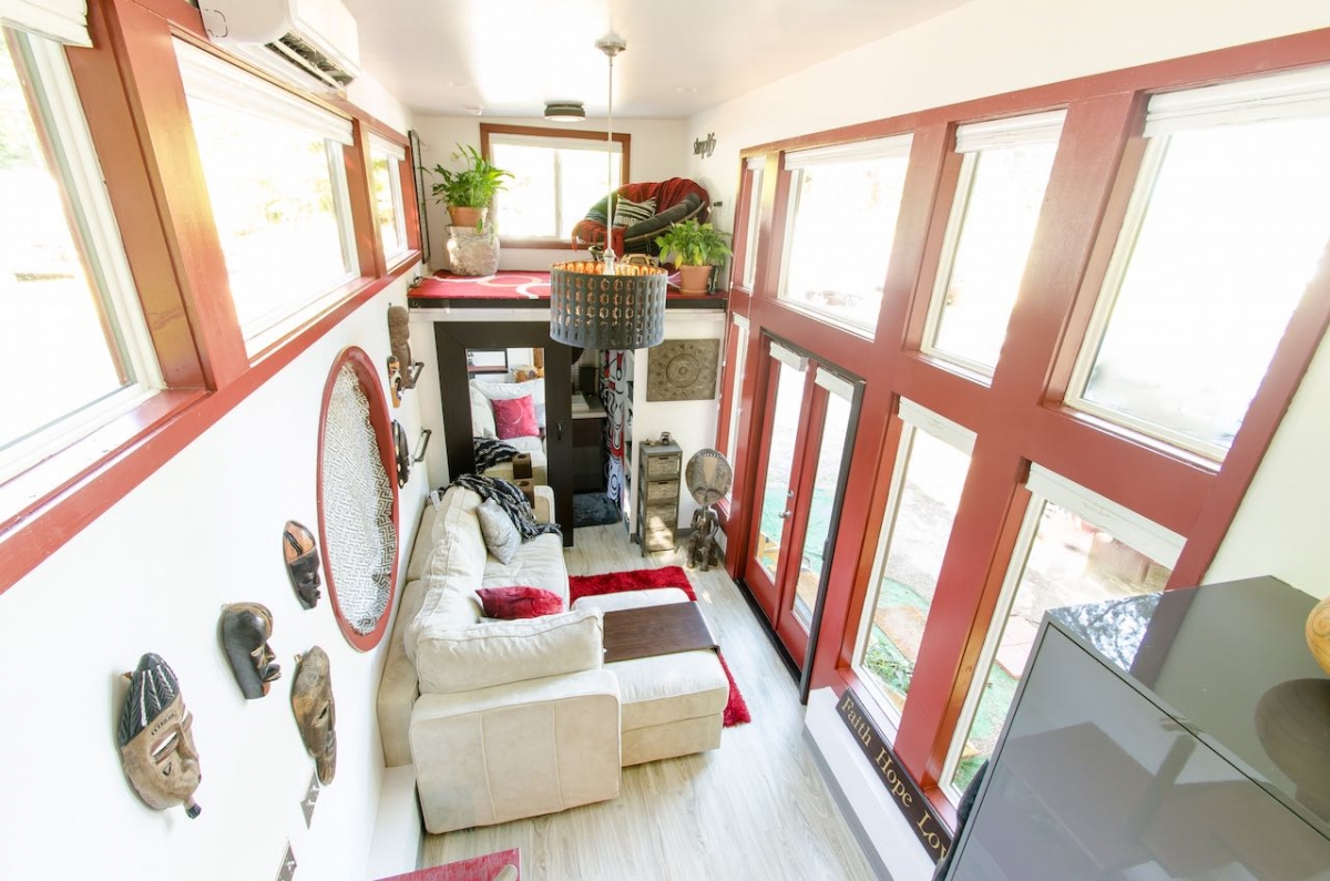Inside of a tiny home that features white and red design.