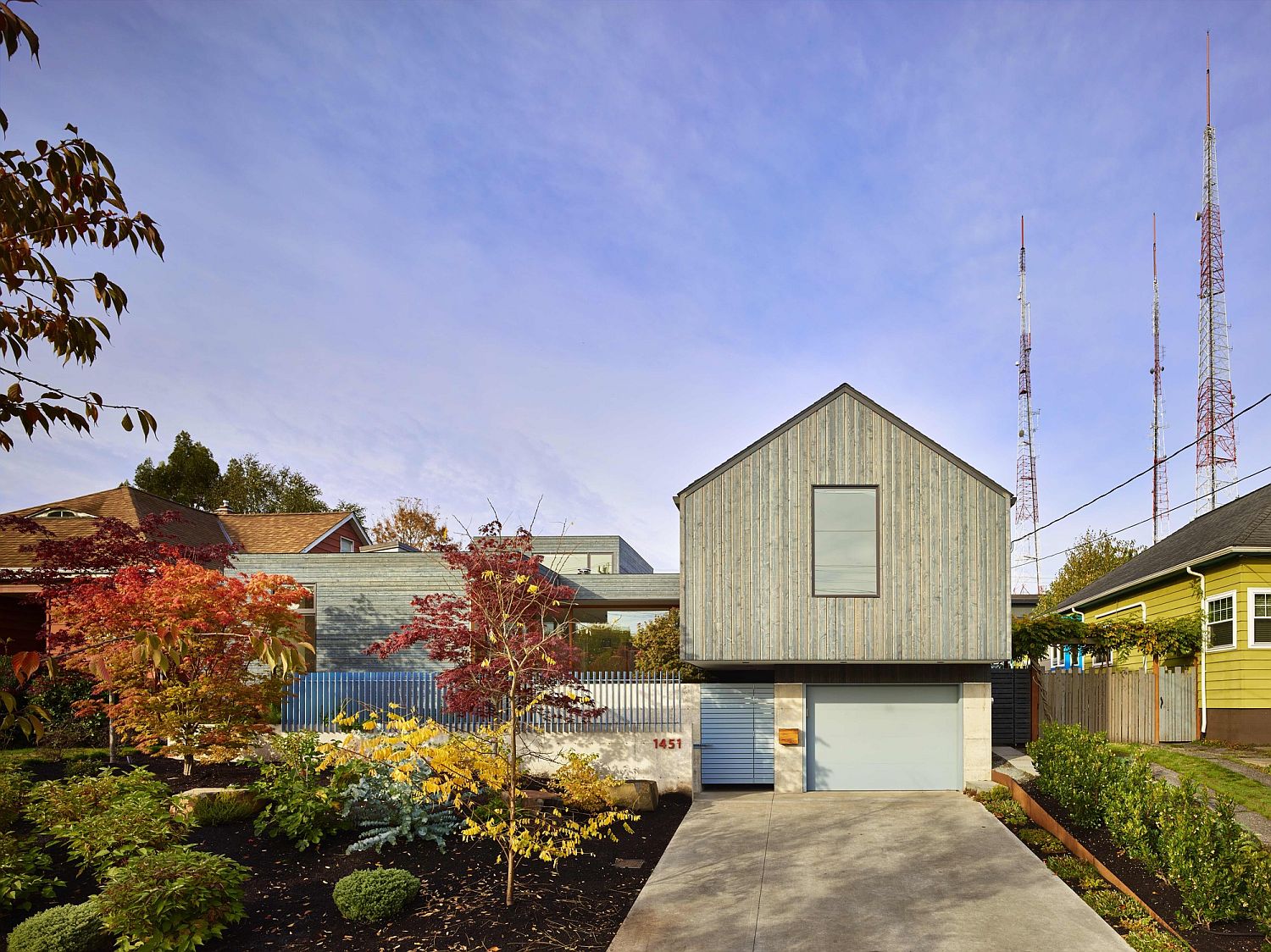 Elevated street facade of the home combines privacy with visual connectivity with the outdoors