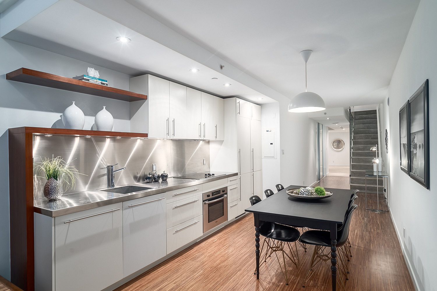 European style kitchen with wooden shelving and top-notch appliances