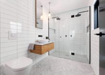 Flooring-of-bathroom-in-white-with-herringbone-pattern-tiles-217x155