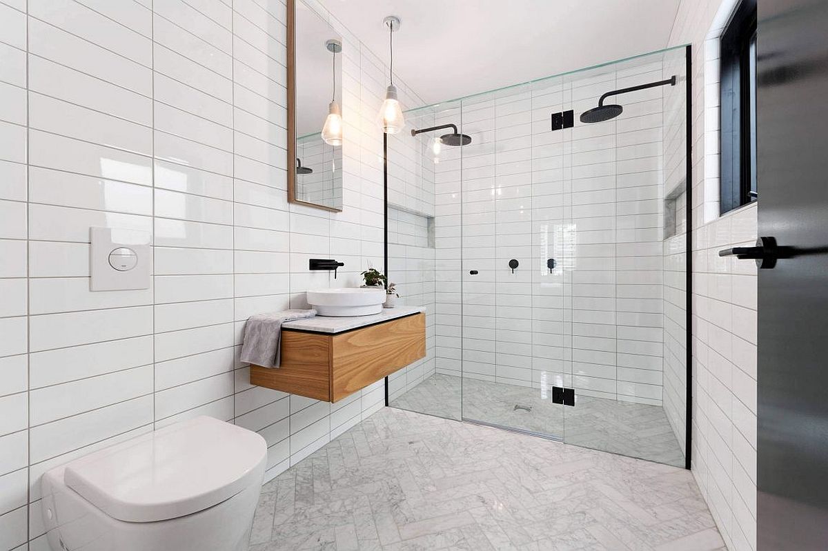 Flooring of bathroom in white with herringbone pattern tiles