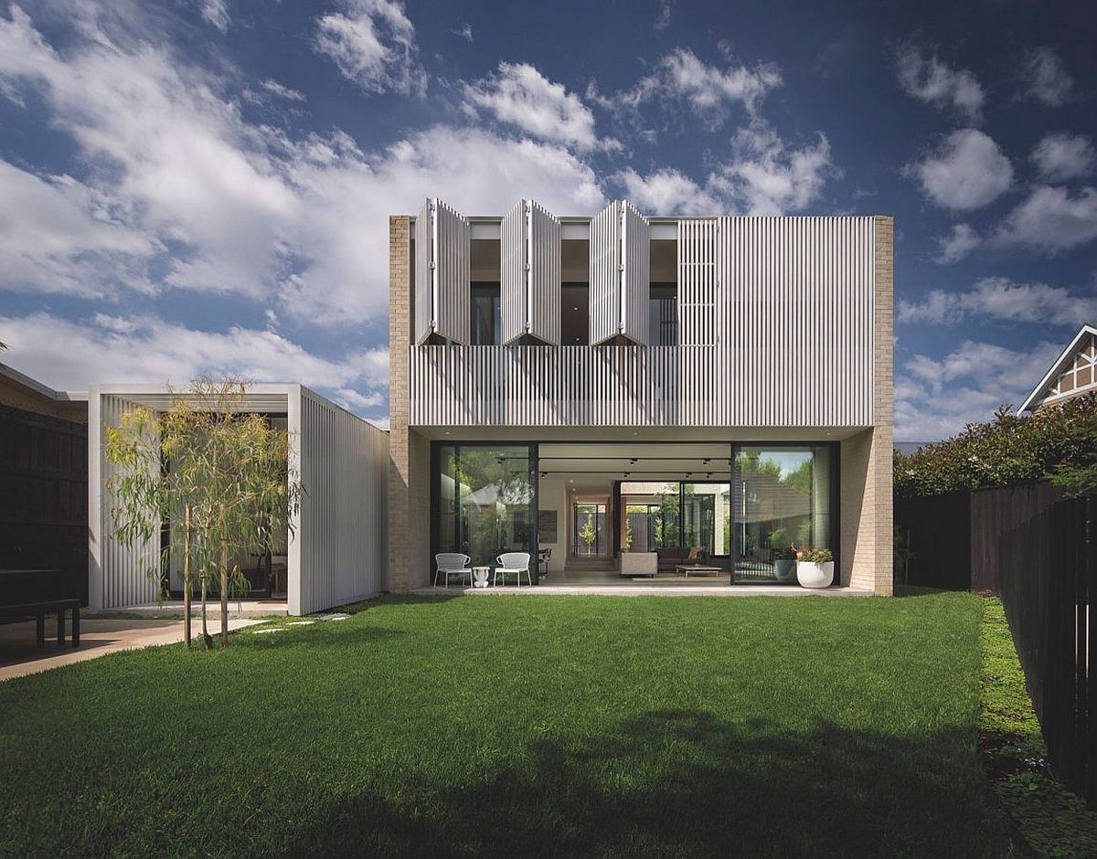 Folding doors on the top level opens up the bedroom towards the garden outside